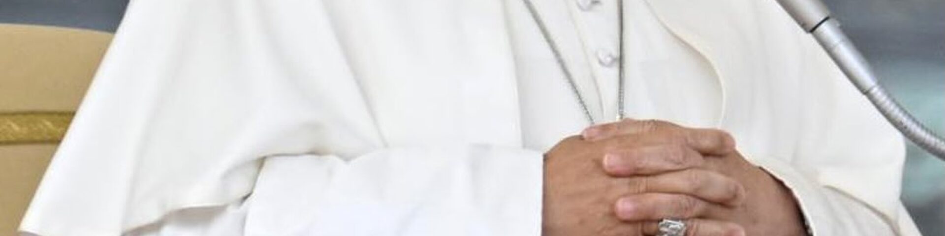 Pope Leo XIV in white cassock with hands clasped at a microphone as he teaches that faith is called to become culture - Photo: @pontifex