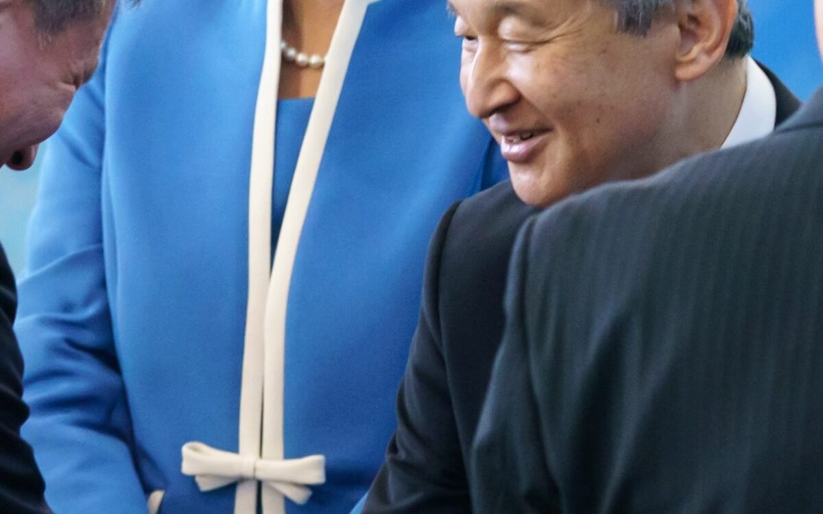 Emperor Naruhito shakes hands with a local resident as Empress Masako in a blue ensemble, white hat and pearls beams during the Imperial couple's visit to Aomori for the 80th National Sports Festival - Photo: @kunaicho_jp
