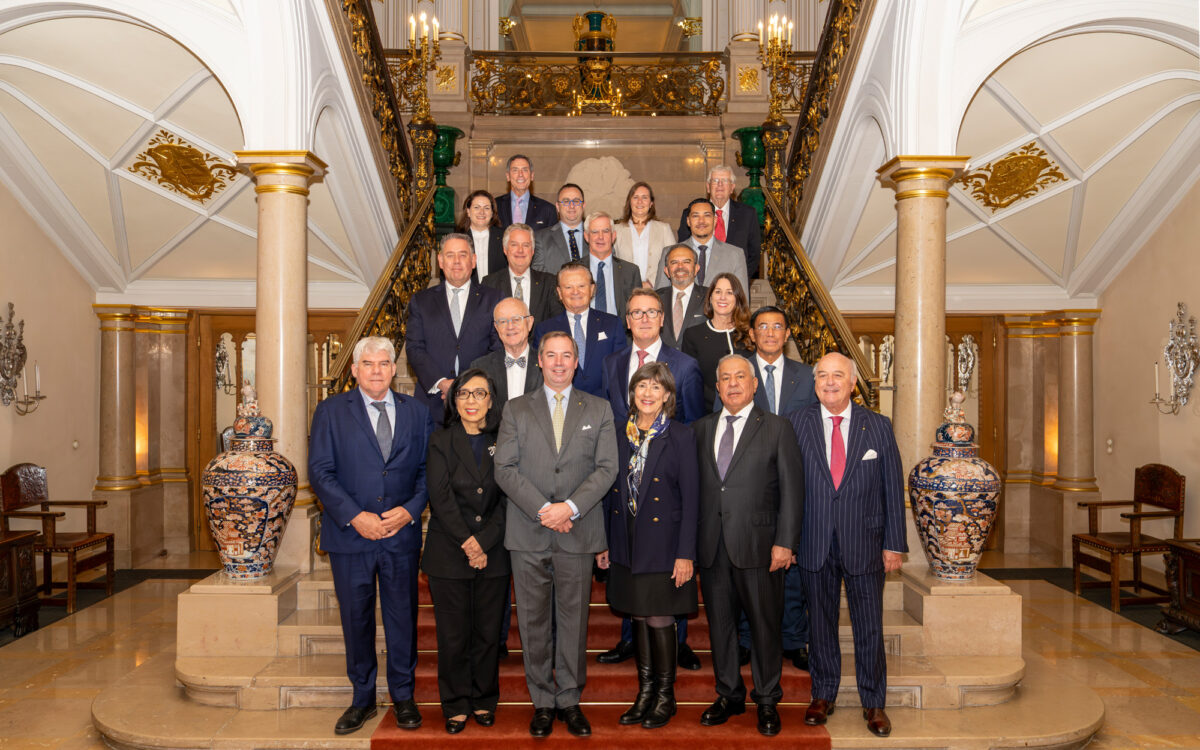 Grand Duke of Luxembourg in a grey suit at the centre of a group portrait with World Scout Foundation board members on the ornate staircase of the Grand Ducal Palace - Photo: Melt Studio / Daniel Wahl
