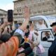 Pope Leo XIV in white cassock waving from the white popemobile to families and pilgrims in St Peter's Square, Vatican City, during the General Audience - Photo: @pontifex